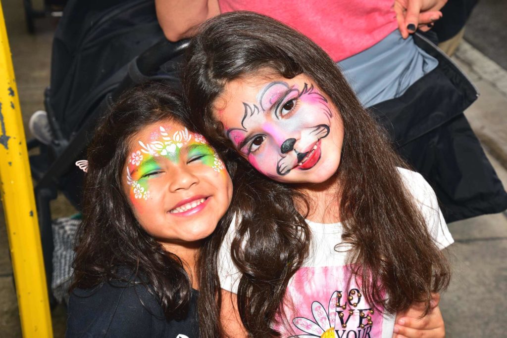 Two smiling little girls with face paint at the 2022 Winterfest Family Fun Day