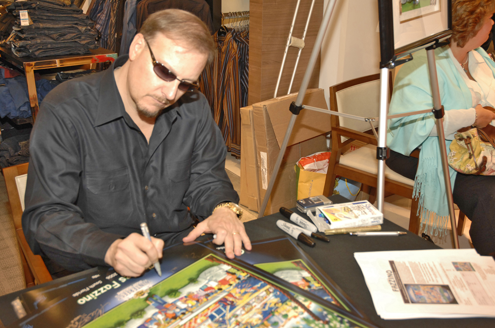 Charles Fazzino signing a past Winterfest Poster