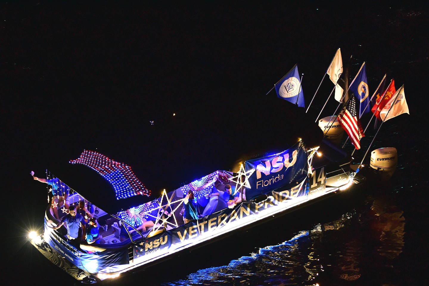 NSU Student Veterans on board Starmarker, boat number 14 in the 2021 Winterfest Boat Parade