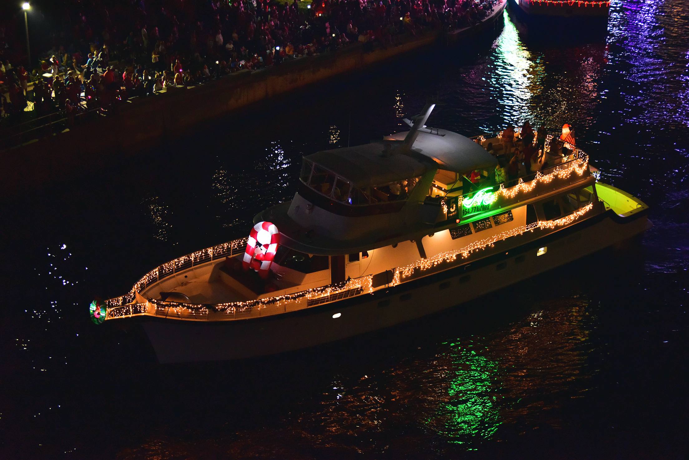 Marine Industries Association on board Summerwind, boat number 5 in the 2021 Winterfest Boat Parade