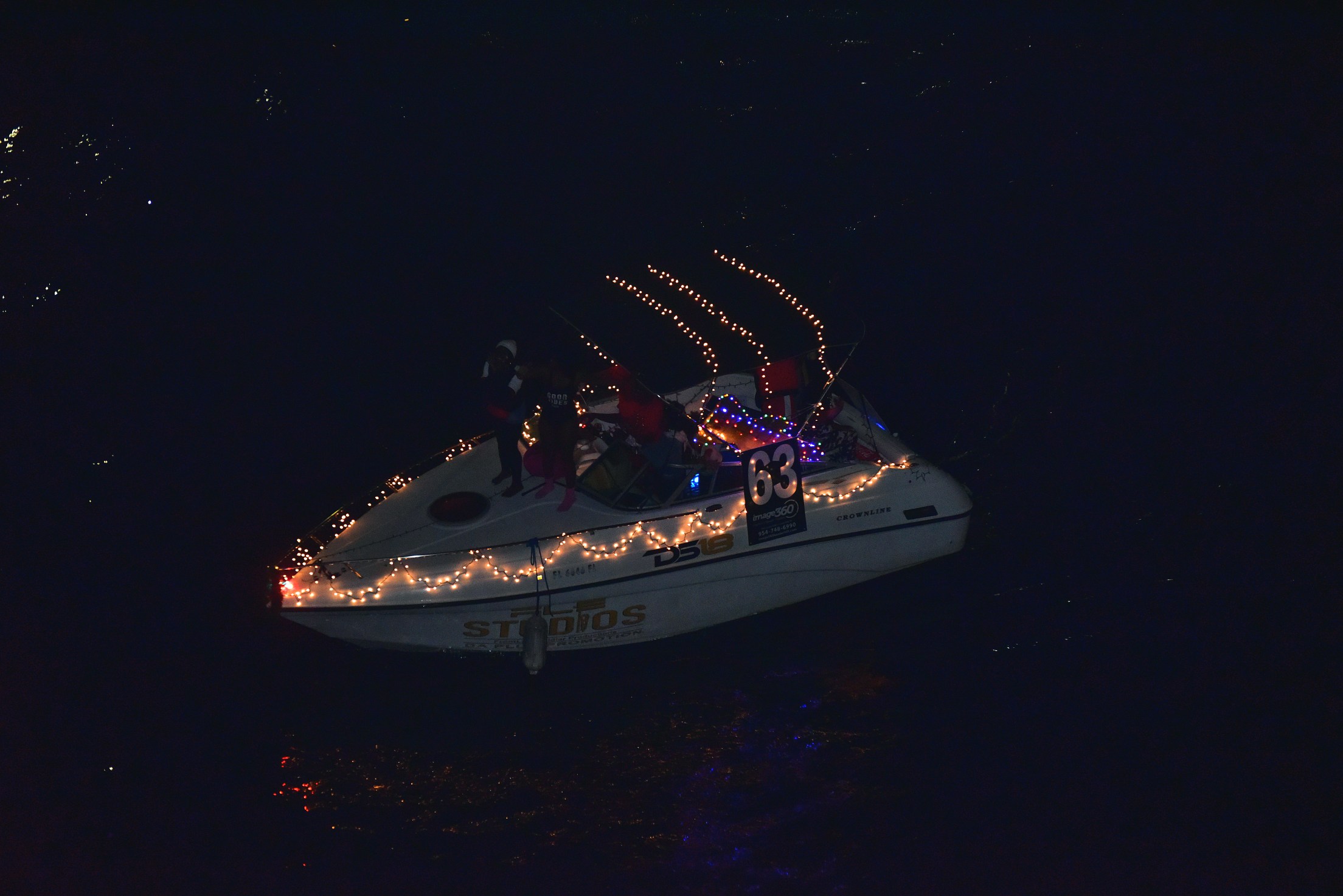 Da Plug Promotion, boat number 63 in the 2021 Winterfest Boat Parade