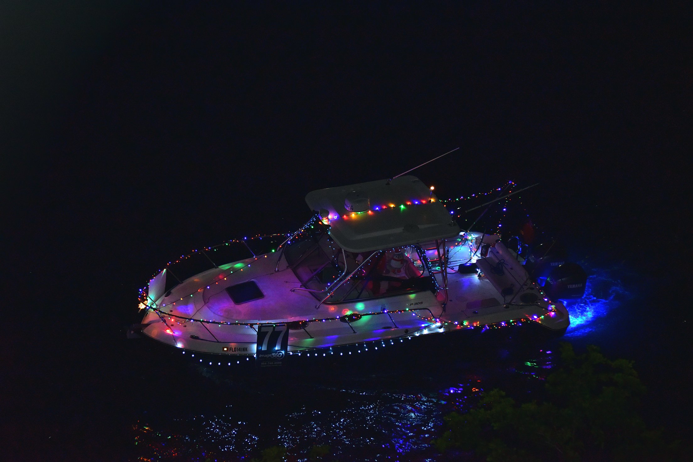 Aquarius, boat number 77 in the 2021 Winterfest Boat Parade