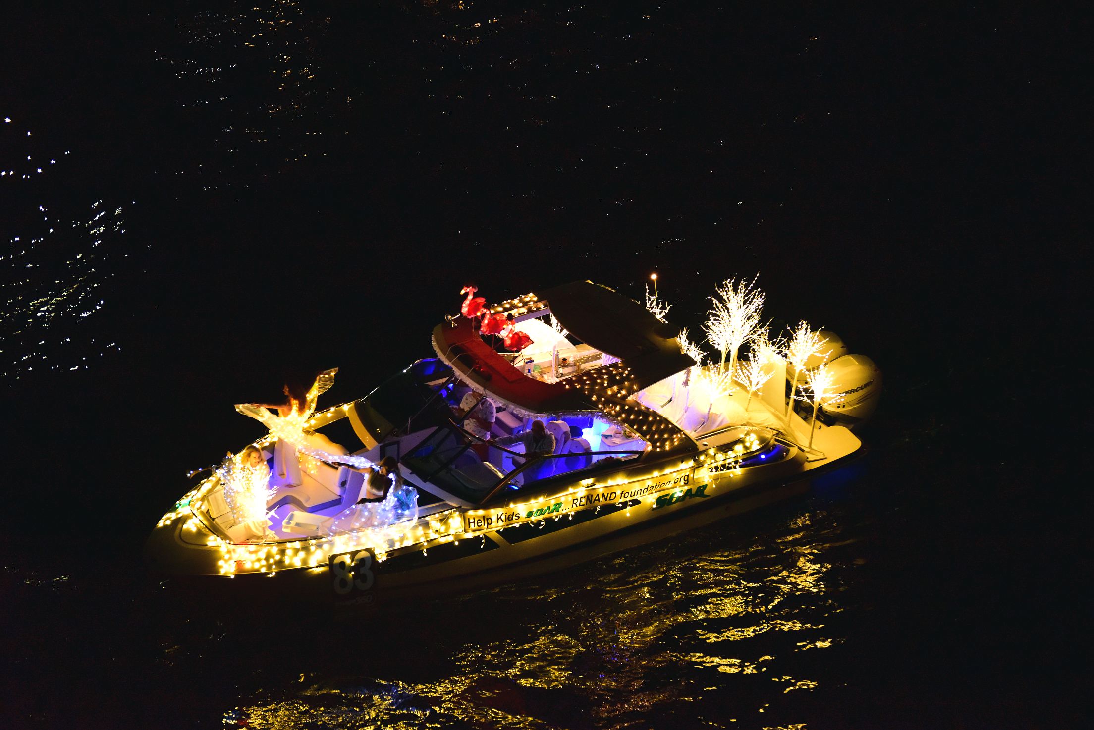 Renand Foundation on board Soar, boat number 83 in the 2021 Winterfest Boat Parade