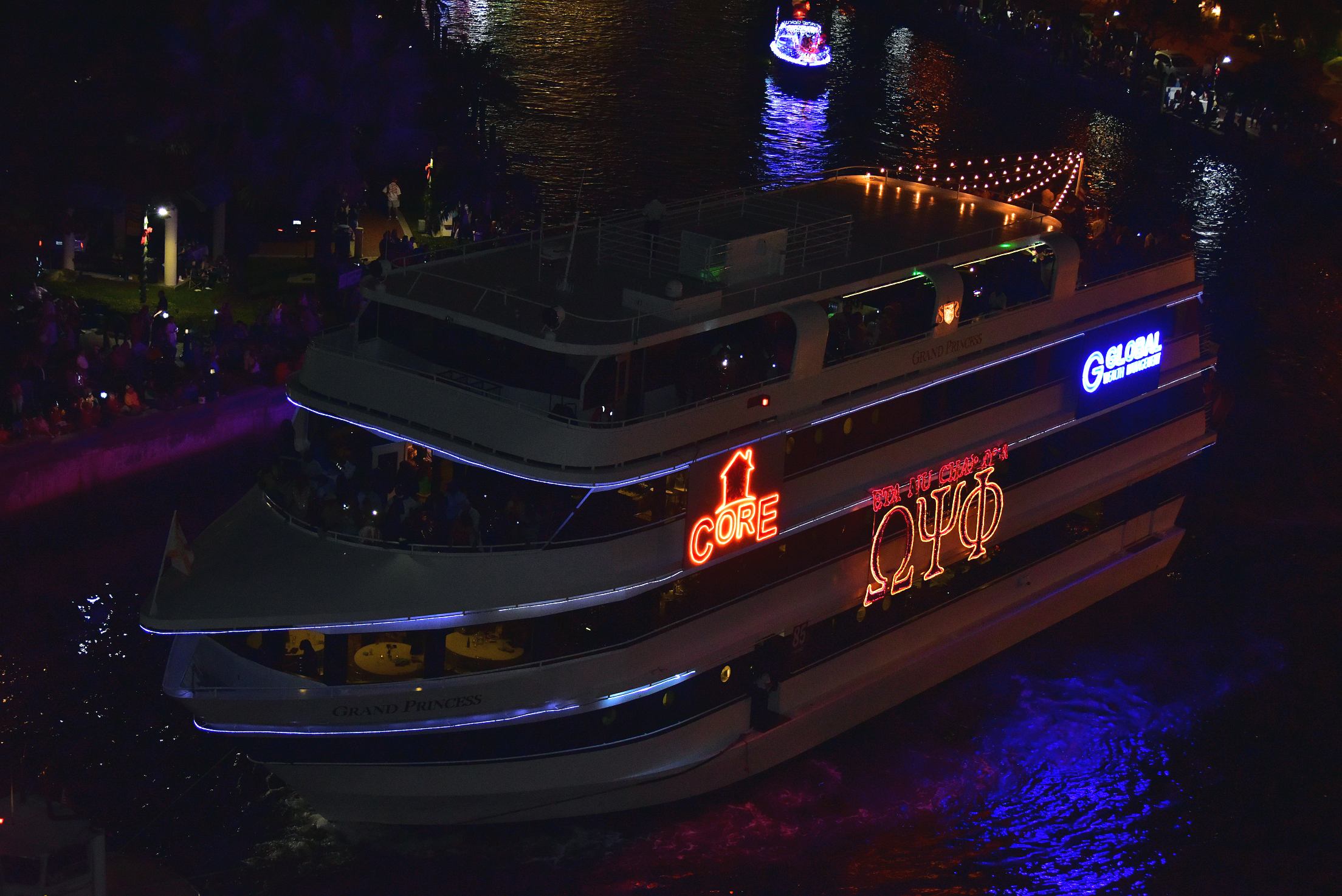 Omega Psi Phi on board The Grand Princess, boat number 85 in the 2021 Winterfest Boat Parade