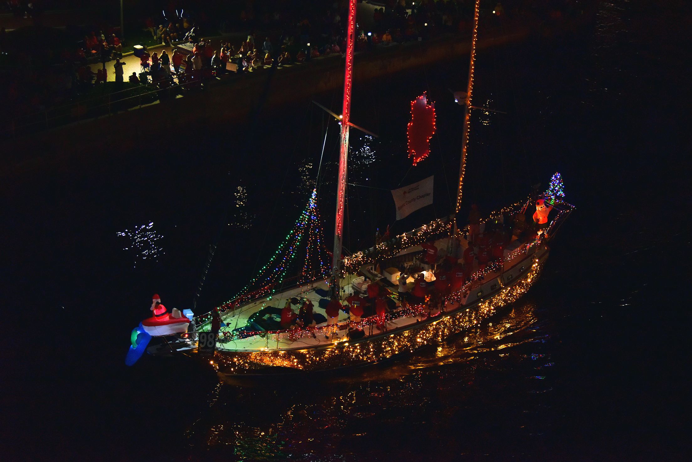 Red Cross on board Unexpected Pleasure, boat number 98 in the 2021 Winterfest Boat Parade
