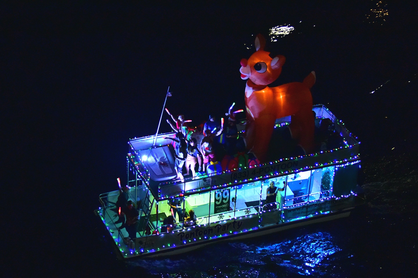 Winterfest Rudolph on board Miss Pontoon, boat number 99 in the 2021 Winterfest Boat Parade