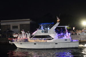 Sea Cadets aboard Archer, boat number 25 in the 2022 Winterfest Boat Parade