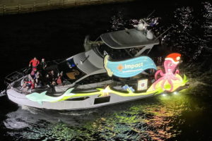 Impact Health Sharing aboard Carry On, boat number 28 in the 2022 Winterfest Boat Parade