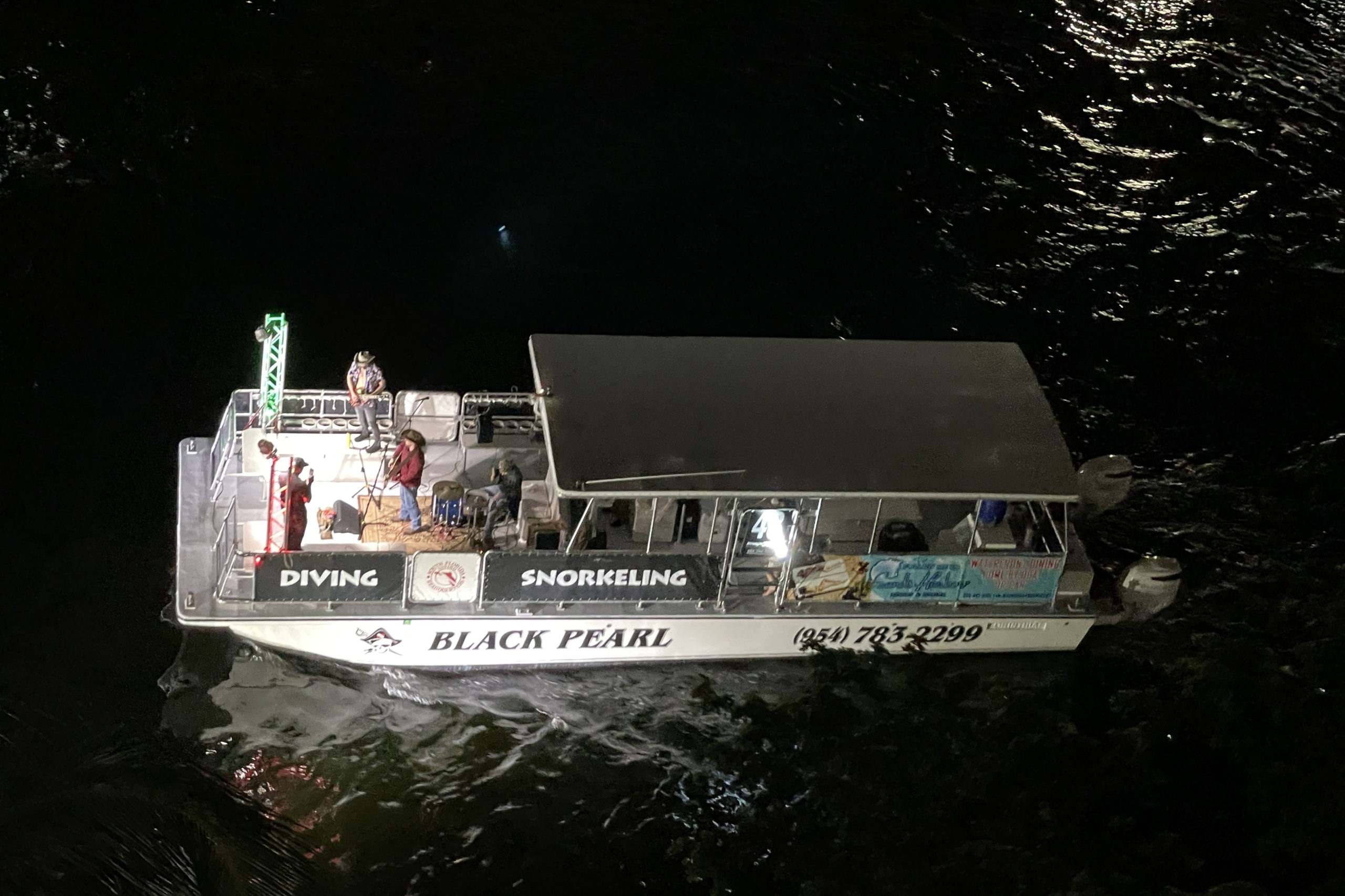 Ricky Valido & the Hialeah Hillbillies aboard Black Pearl, boat number 48 in the 2022 Winterfest Boat Parade