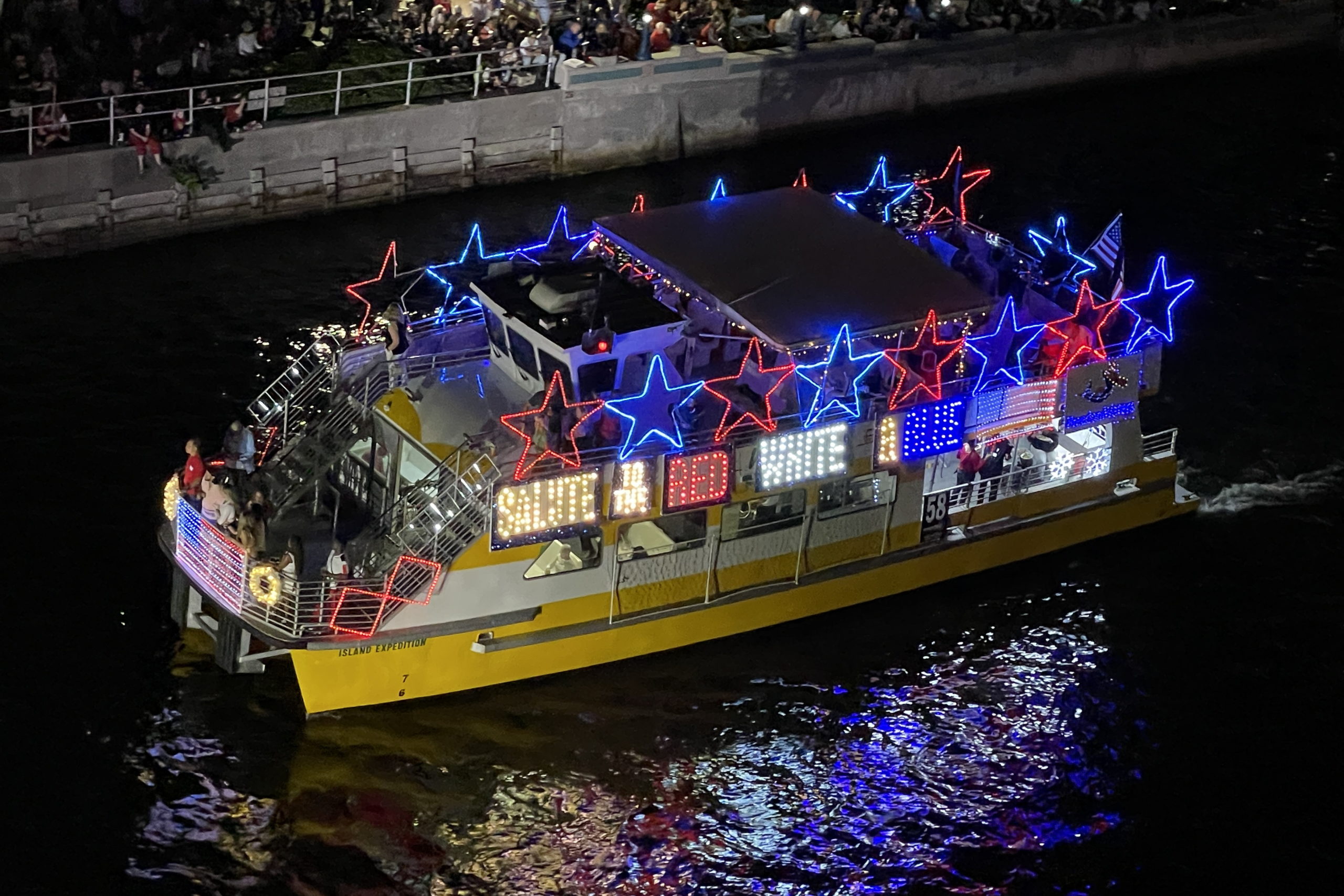Freedom Waters aboard Water Taxi Island Expedition, boat number 58 in the 2022 Winterfest Boat Parade