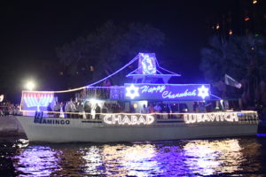 Chabad Lubavitch of Ft Lauderdale aboard Flamingo, boat number 73 in the 2022 Winterfest Boat Parade