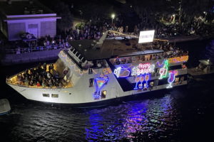 RNDC aboard Caprice, boat number 8 in the 2022 Winterfest Boat Parade