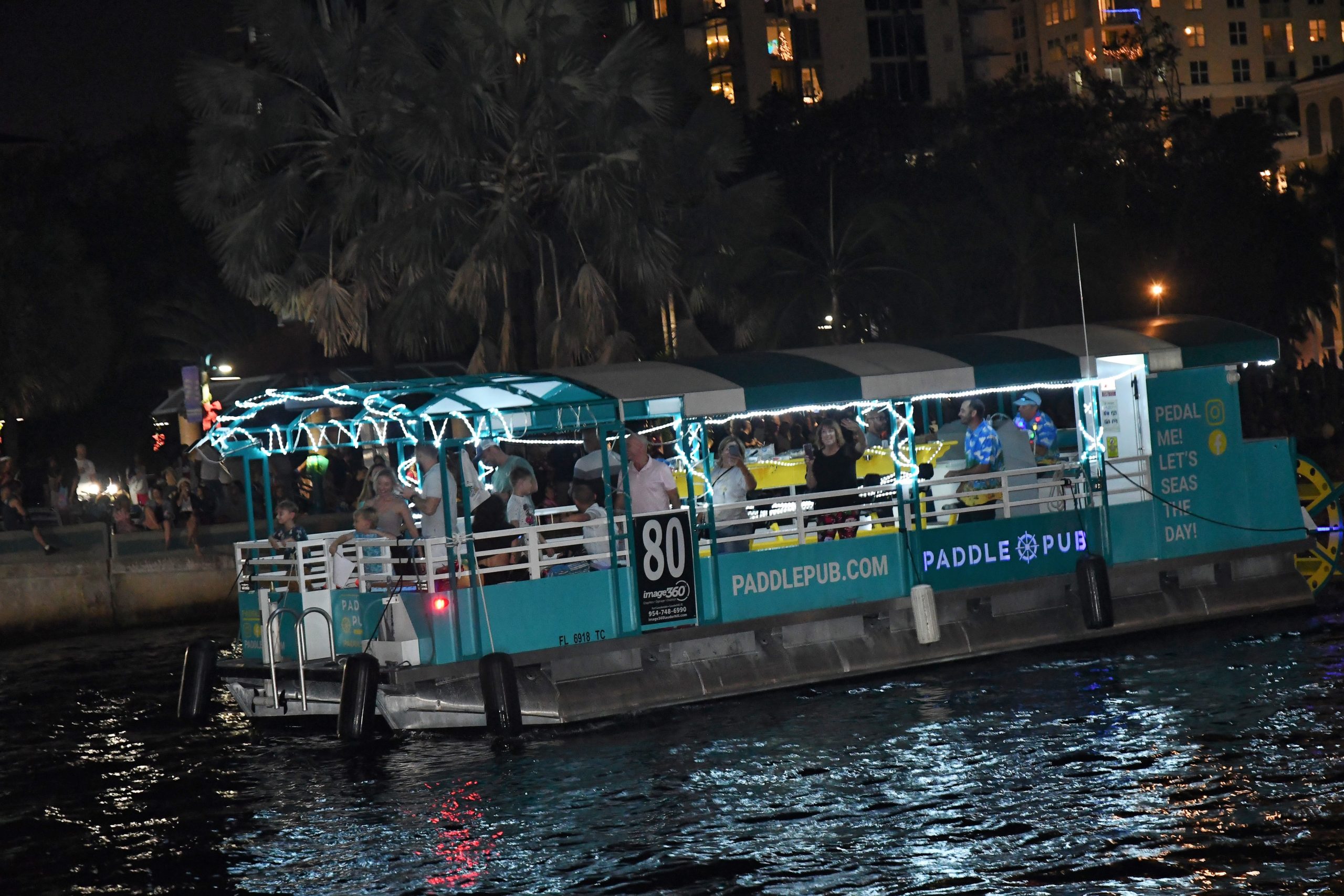 Paddle Pub, boat number 80 in the 2022 Winterfest Boat Parade