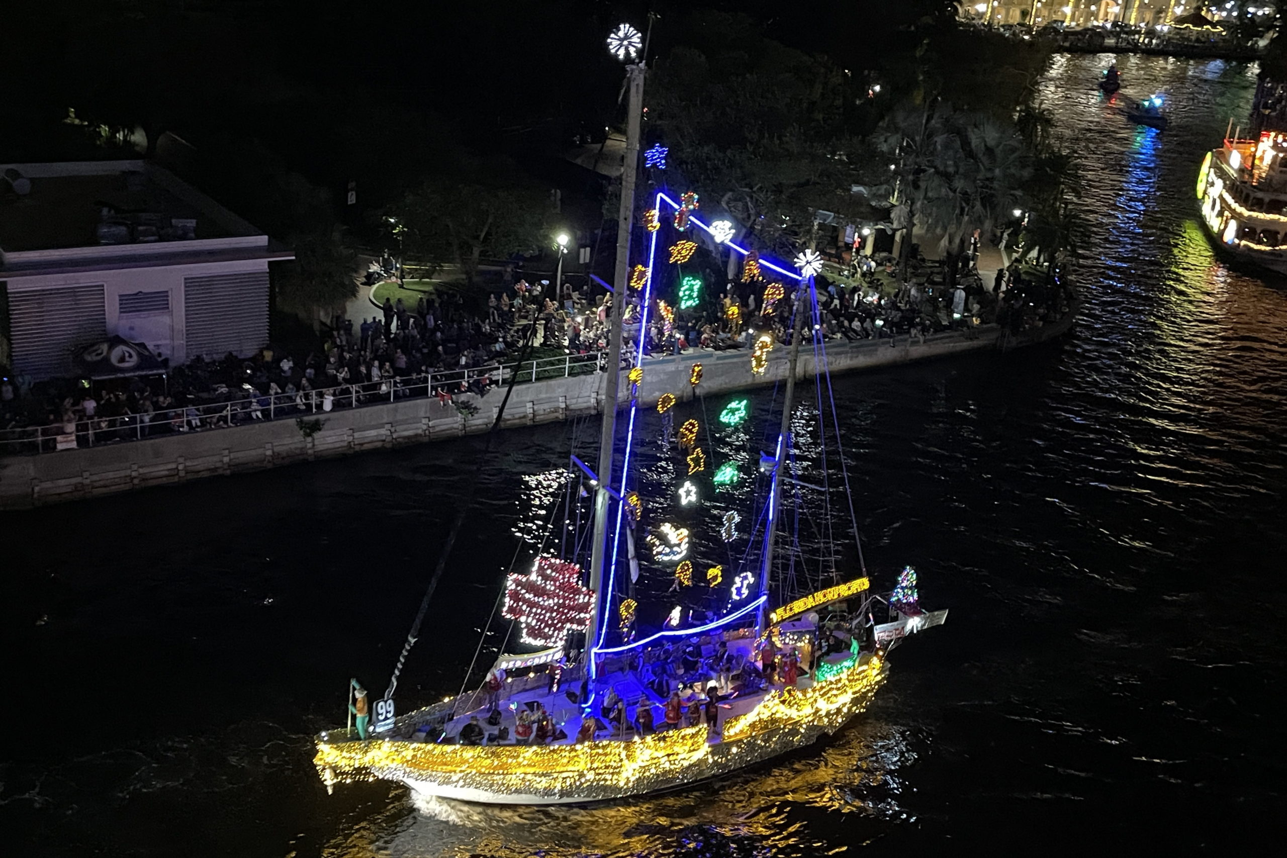 Unexpected Pleasure with The True Aquaman, boat number 99 in the 2022 Winterfest Boat Parade