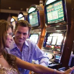 People seated at slot machines at the Seminole Hard Rock Hotel & Casino