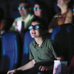 People enjoying a 3-D Imax film at MODS